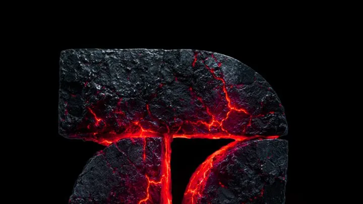 Logotipo de Frequence esculpido en roca volcánica con lava incandescente